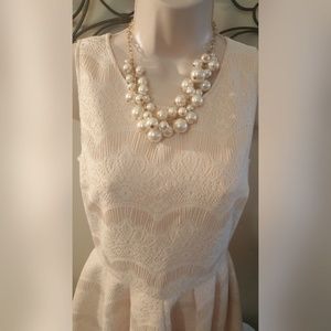 Love...ady dress with a lace overlay.